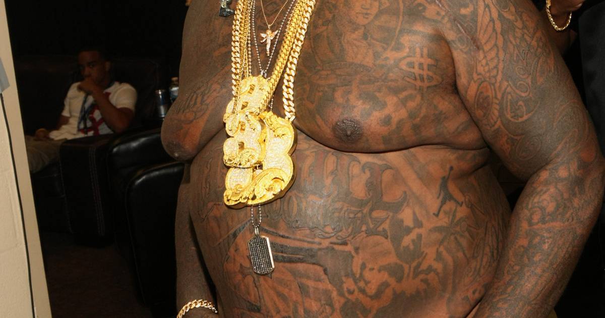 Rick Ross torso and stomach tattoos