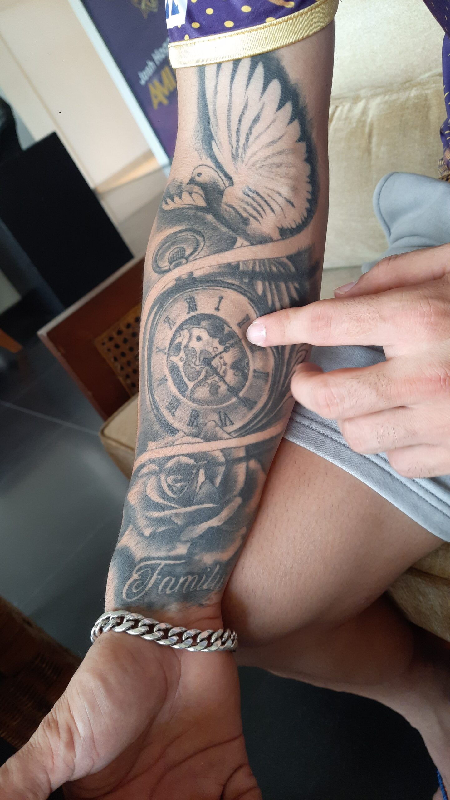 Rinku Singh clock, dove and Family forearm tattoo Rinku Singh tattoos: clock, dove and Family tattoo evidence