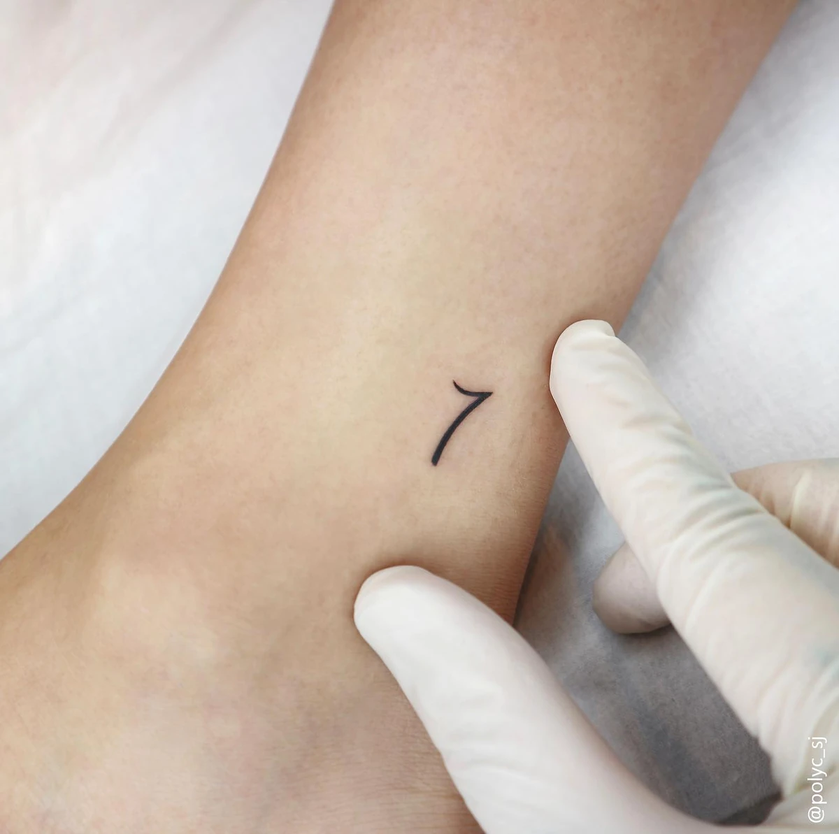 RM clean studio close-up of the small 7 on RM's ankle RM tattoos: clean studio close-up of the small 7 on RM's ankle