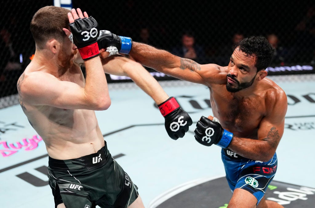 Rob Font tattoos: The cross and banner on the right upper arm
