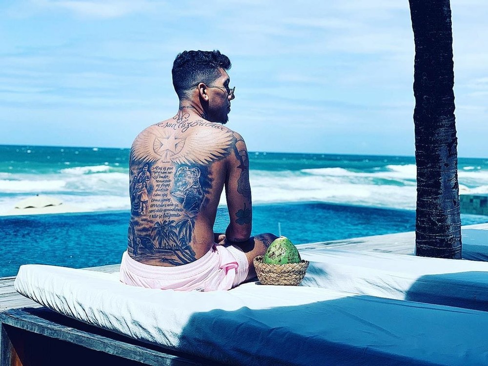 Roberto Firmino tattoos: full back tattoo with Maceio and football themes