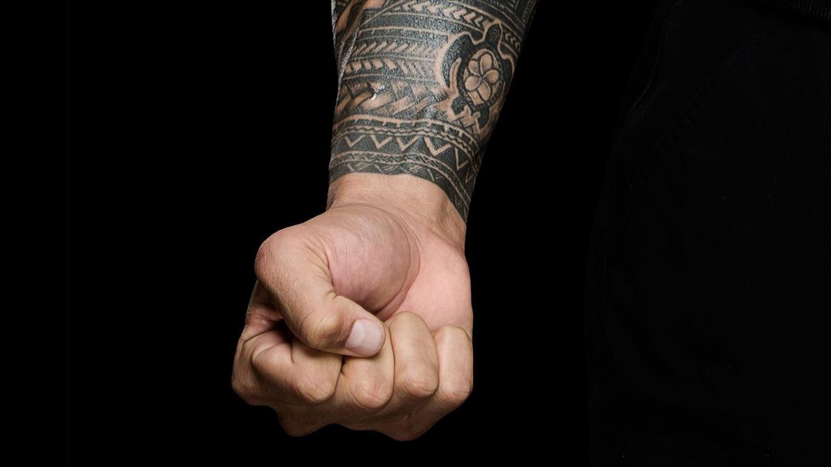 Roman Reigns wrist turtle tattoo