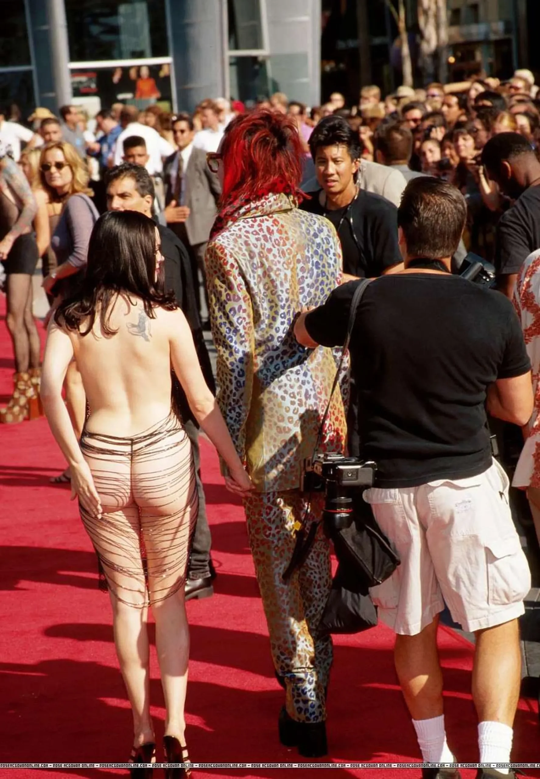 Rose McGowan tattoo visible at a red carpet event