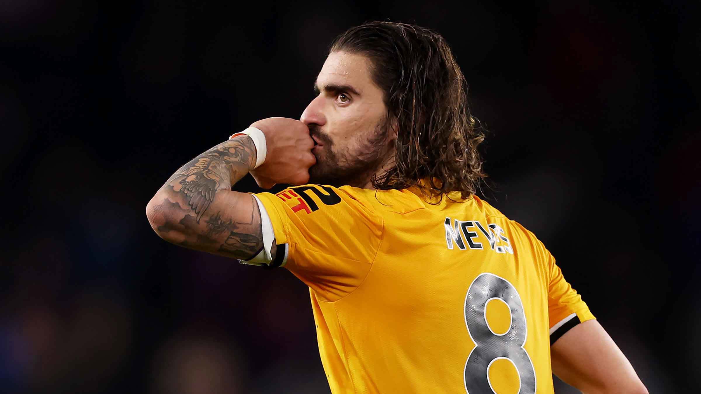 Rúben Neves Wolves match celebration contextual photo Rúben Neves in a contextual photograph: A footballer whose arms already carried stories; not tattoo evidence