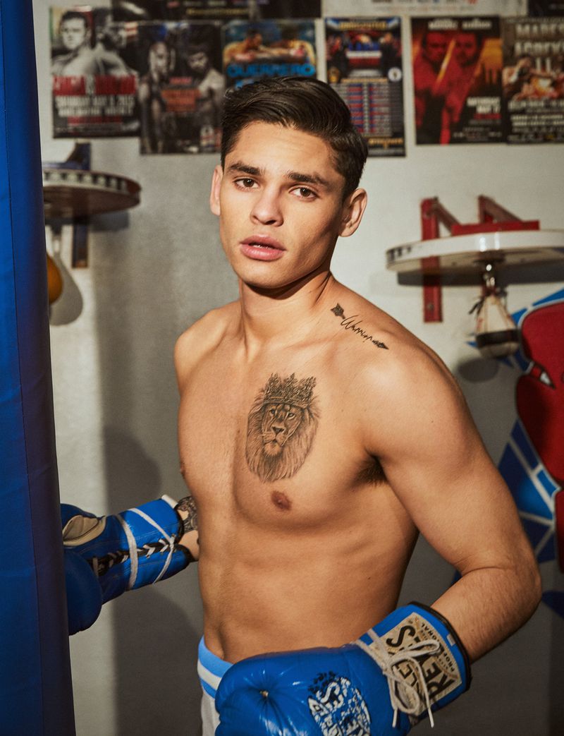Ryan Garcia tattoos: lion chest tattoo and shoulder script