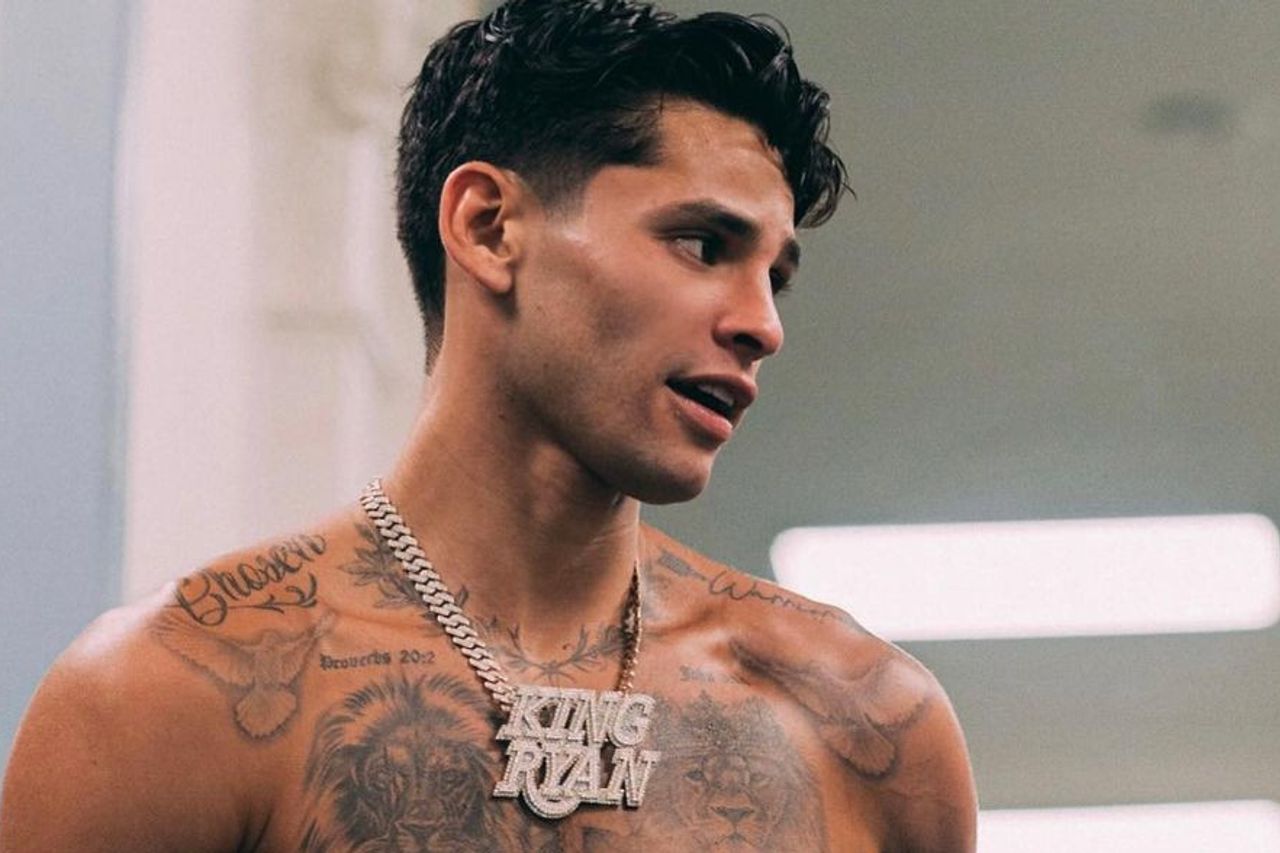 Ryan Garcia tattoos: lion chest and collarbone script