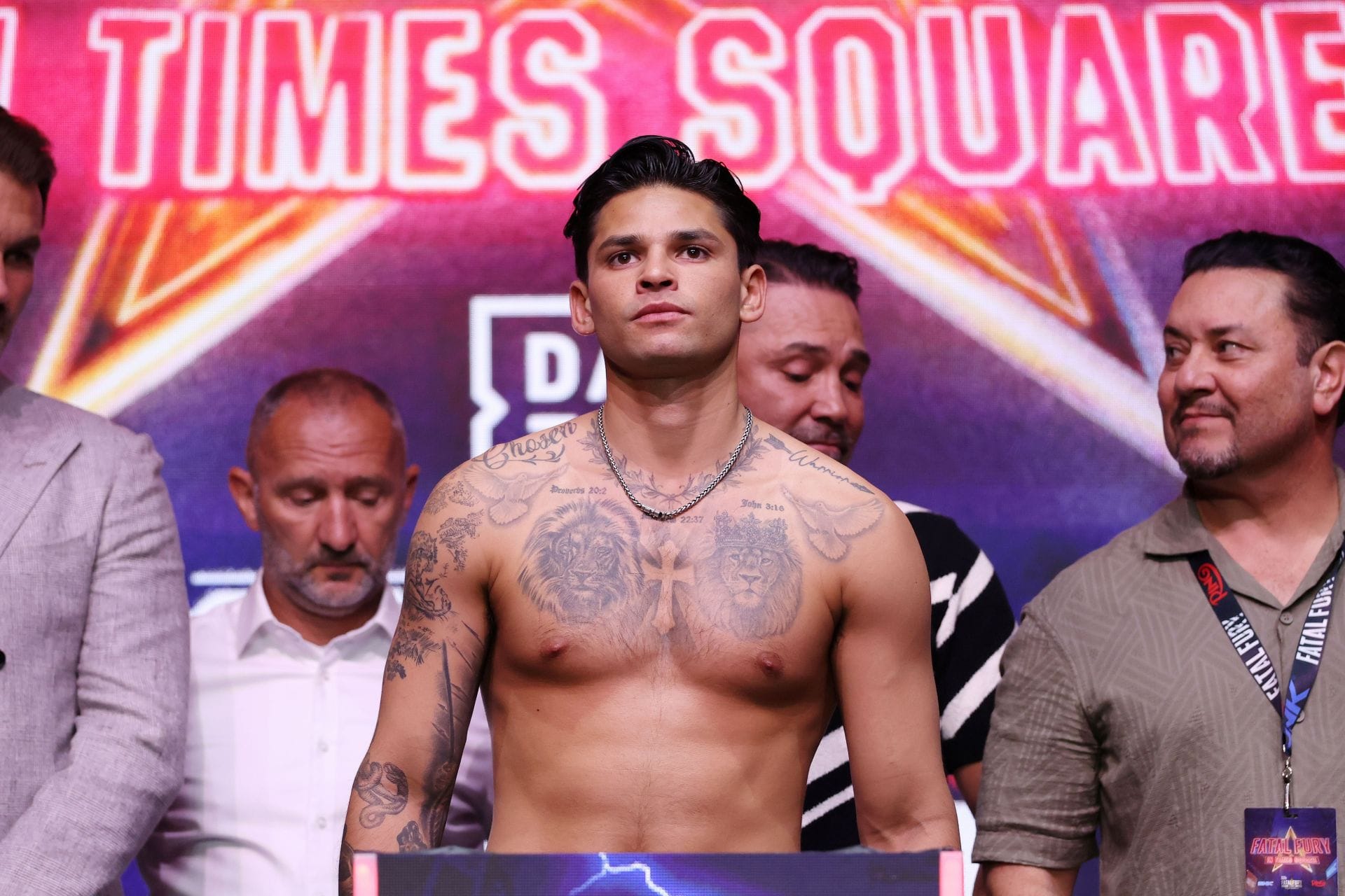 Ryan Garcia tattoos: twin lions, scripture and arm work