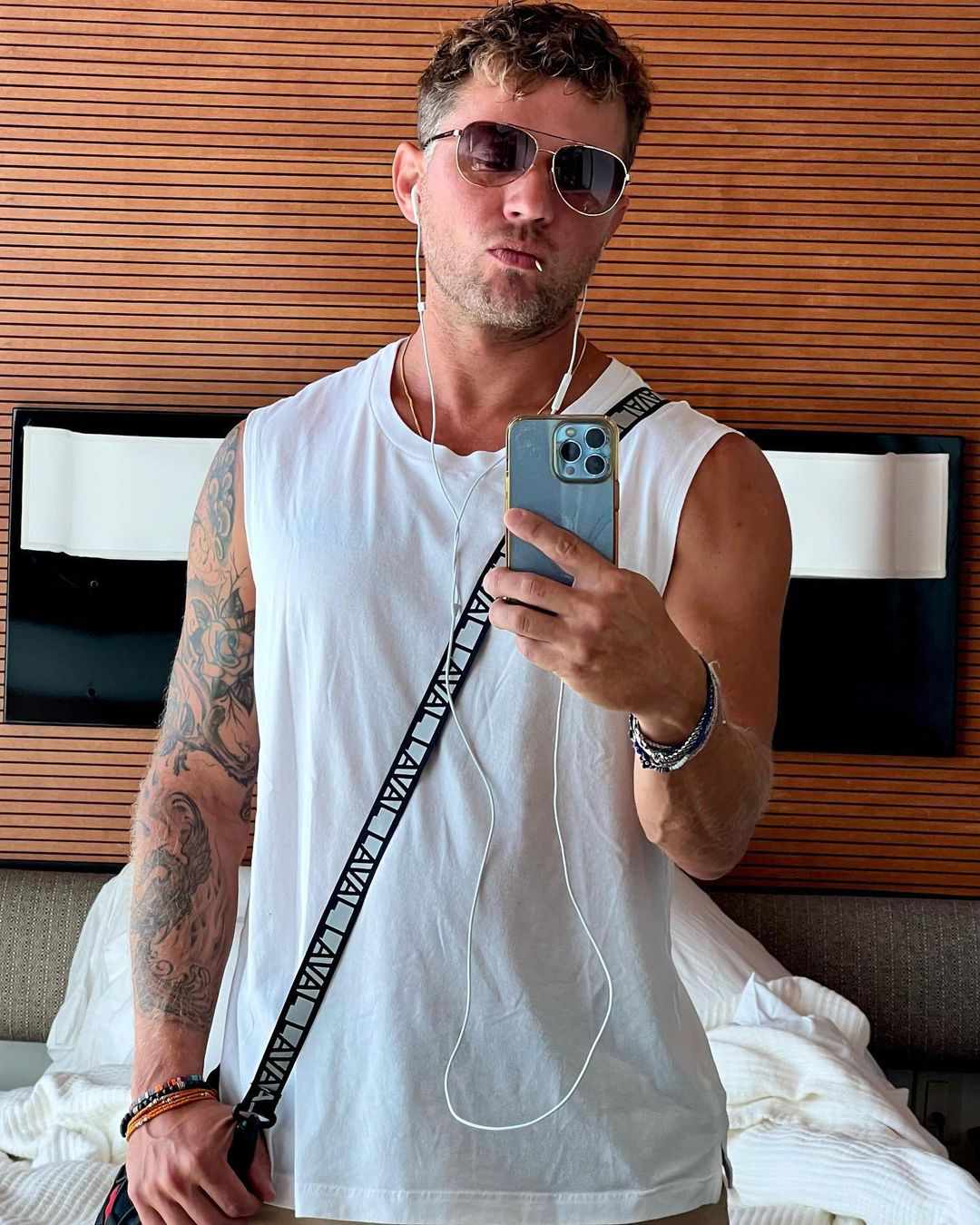 Ryan Phillippe tattoos: A mirror portrait that gives a separate view of the sleeve, forearm, and chest-side tattoo coverage