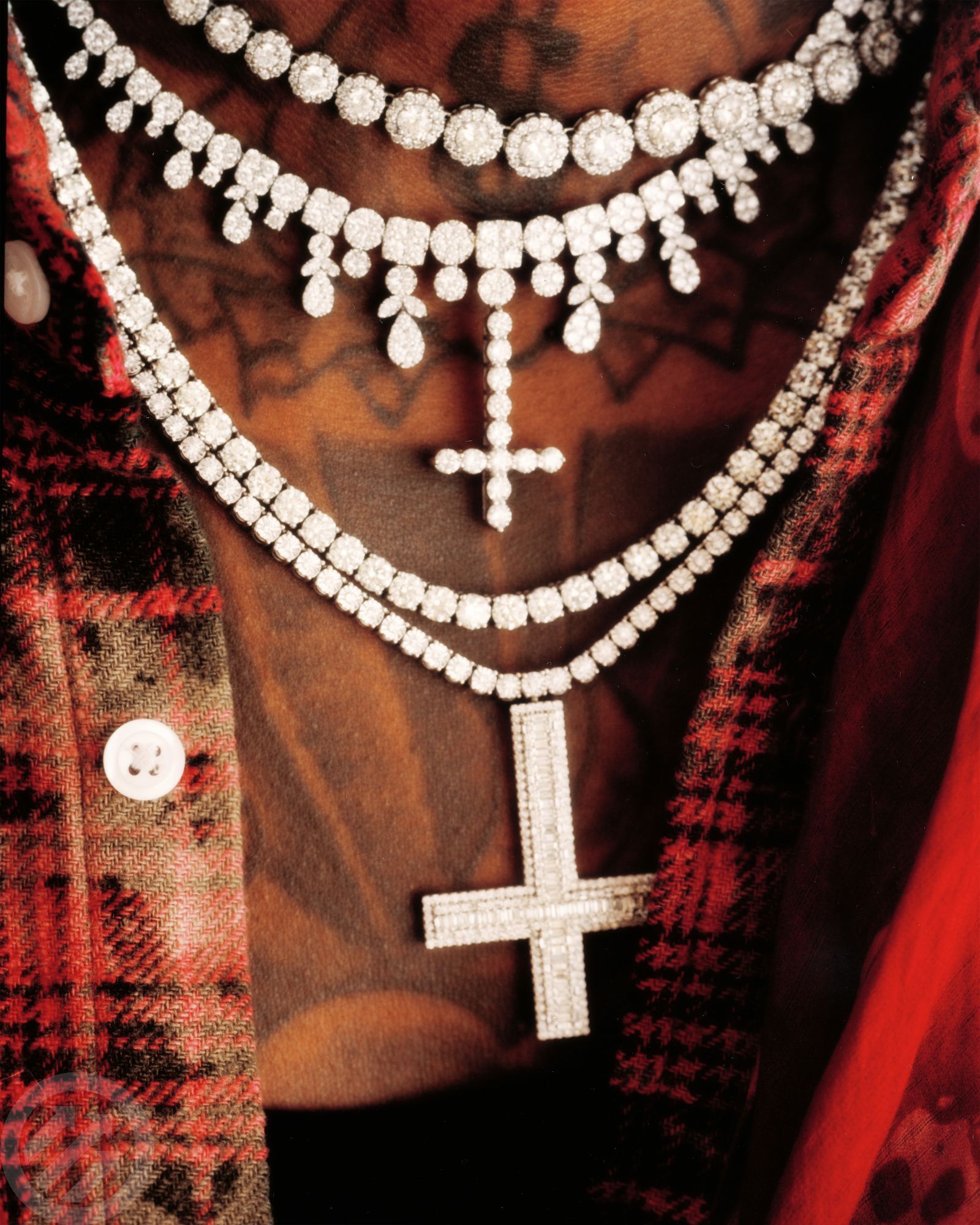 SahBabii tattoos: high-resolution close-up showing the upper chest tattoo details beneath his chains