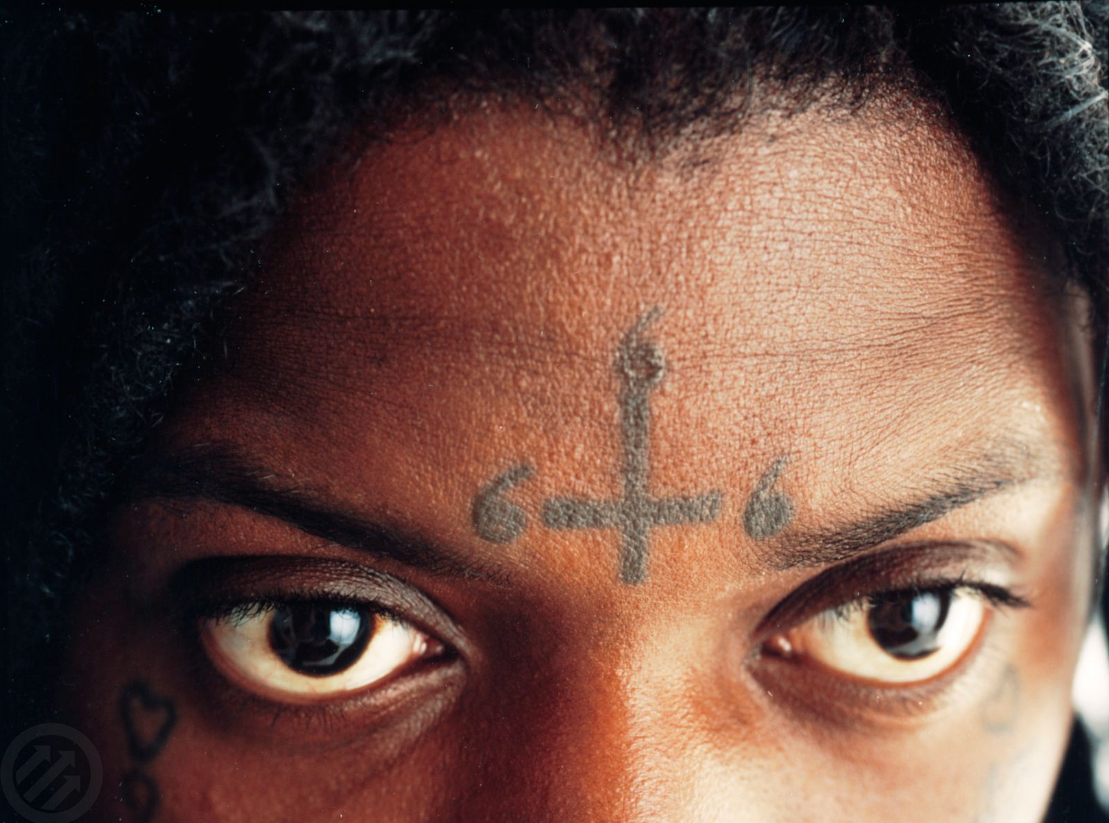 SahBabii tattoos: high-resolution face-visible portrait showing the forehead, cheek and neck ink from a separate angle