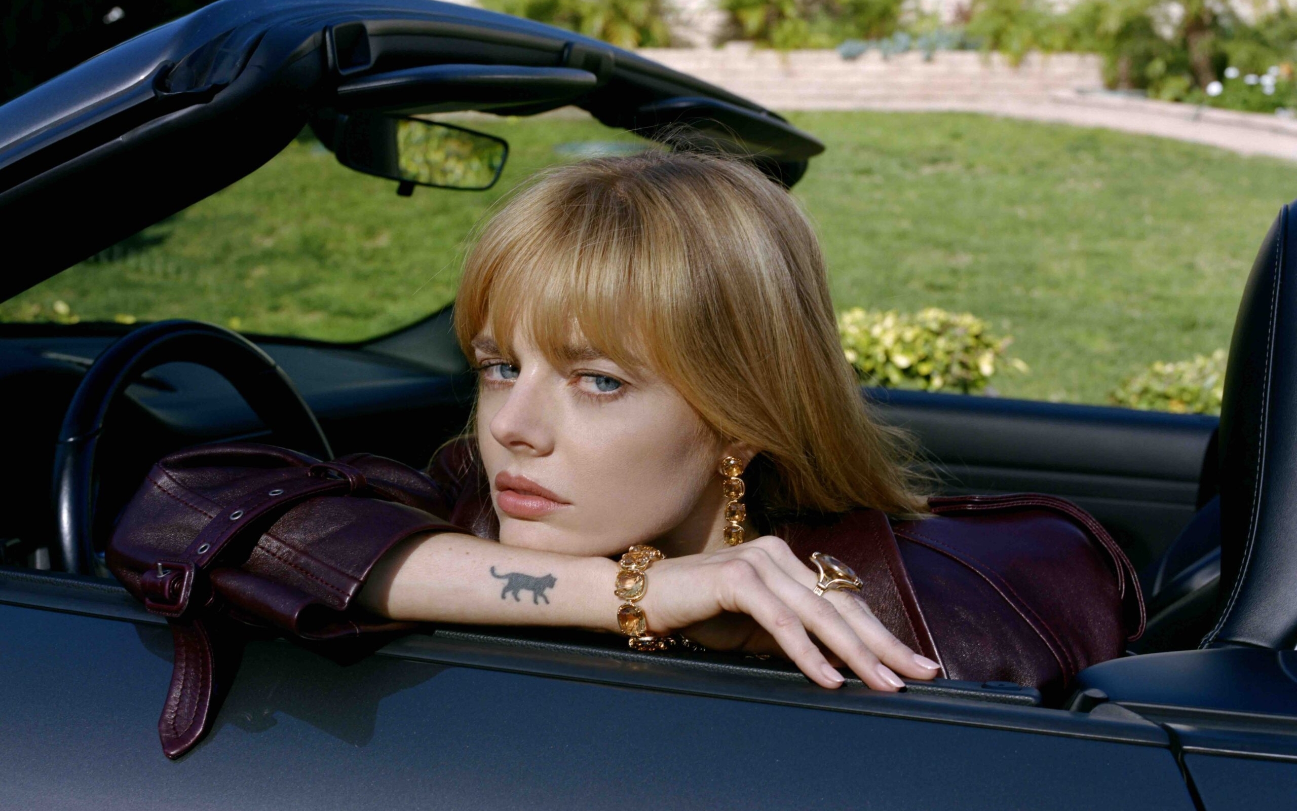 Samara Weaving cat tattoo second view Samara Weaving tattoos: Genuine tattoo photograph showing the same small black cat on the forearm in a second view