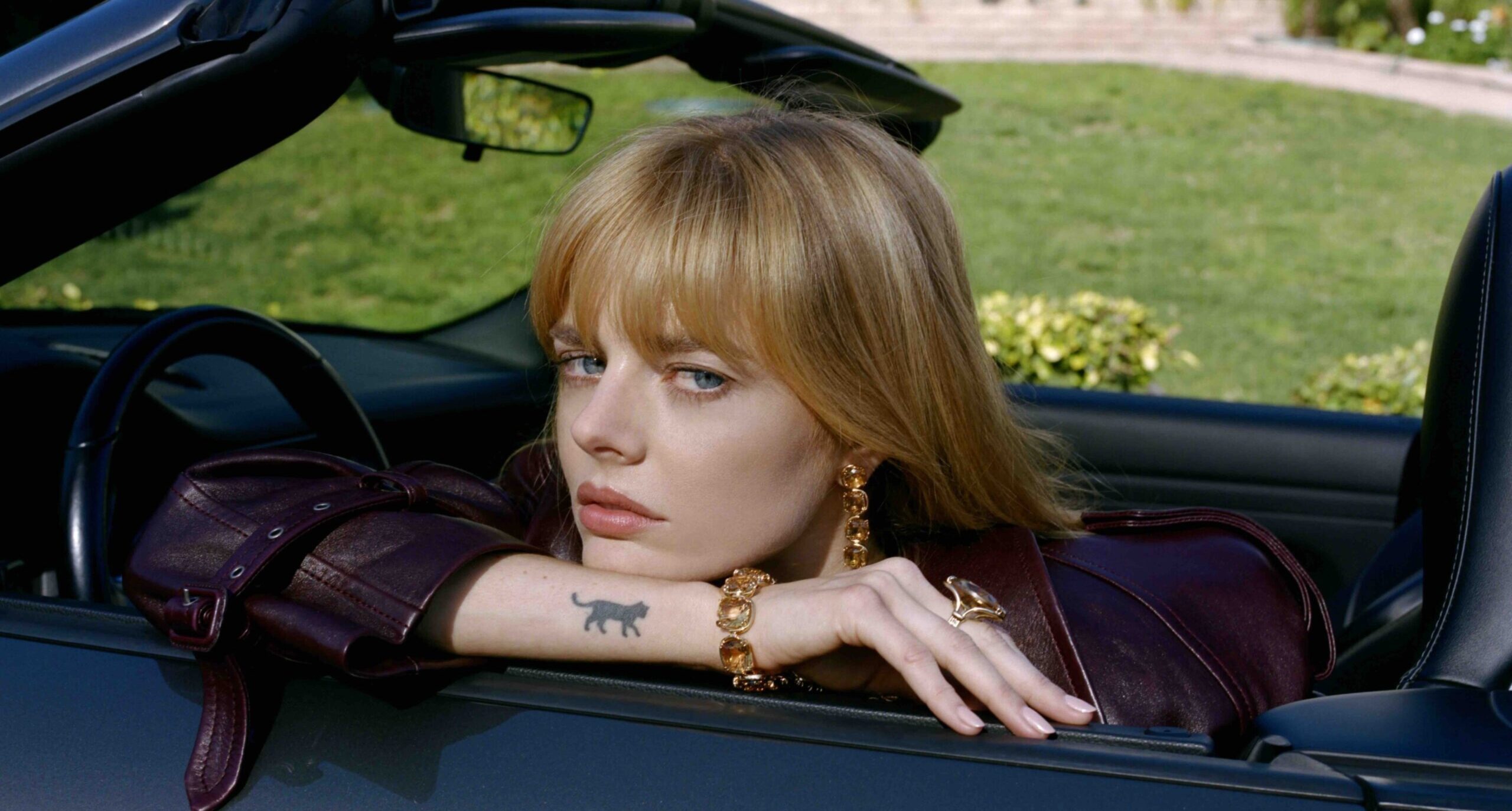 Samara Weaving cat wrist tattoo Samara Weaving tattoos: Genuine tattoo photograph showing the small black cat on the forearm