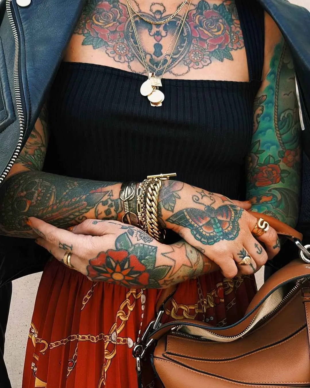 Sammi Jefcoate tattoos: The moth and flower tattoos on her hands