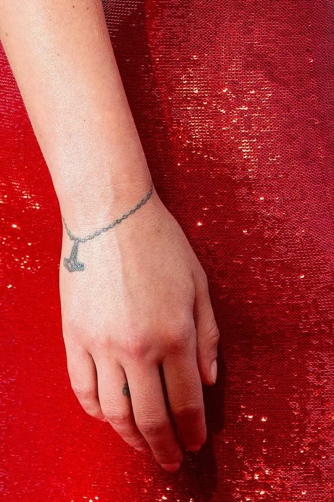 Scarlett Johansson wrist charm bracelet tattoo