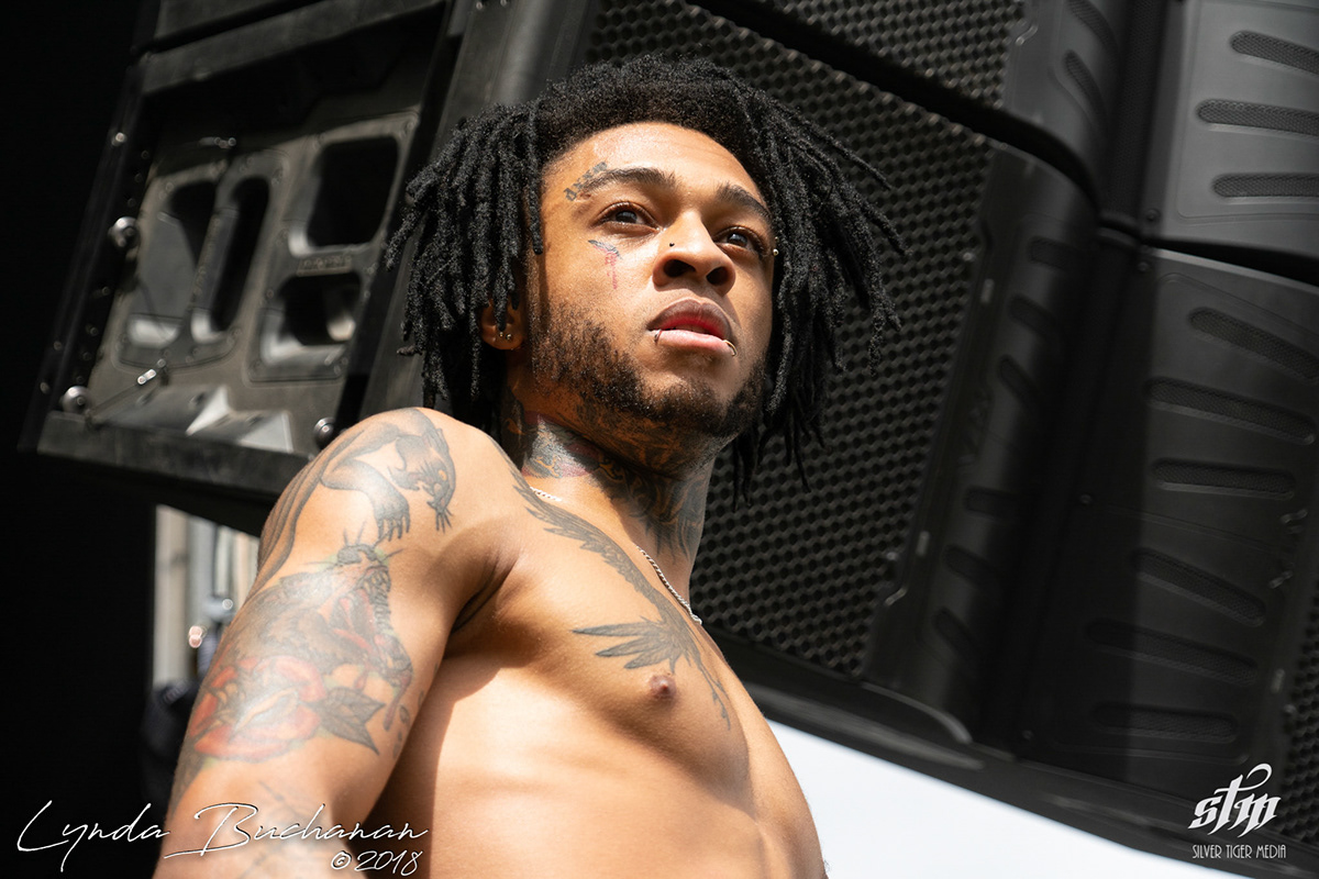Scarlxrd tattoos: high-resolution side portrait showing the wolf, rose, chest bird and neck tattoos