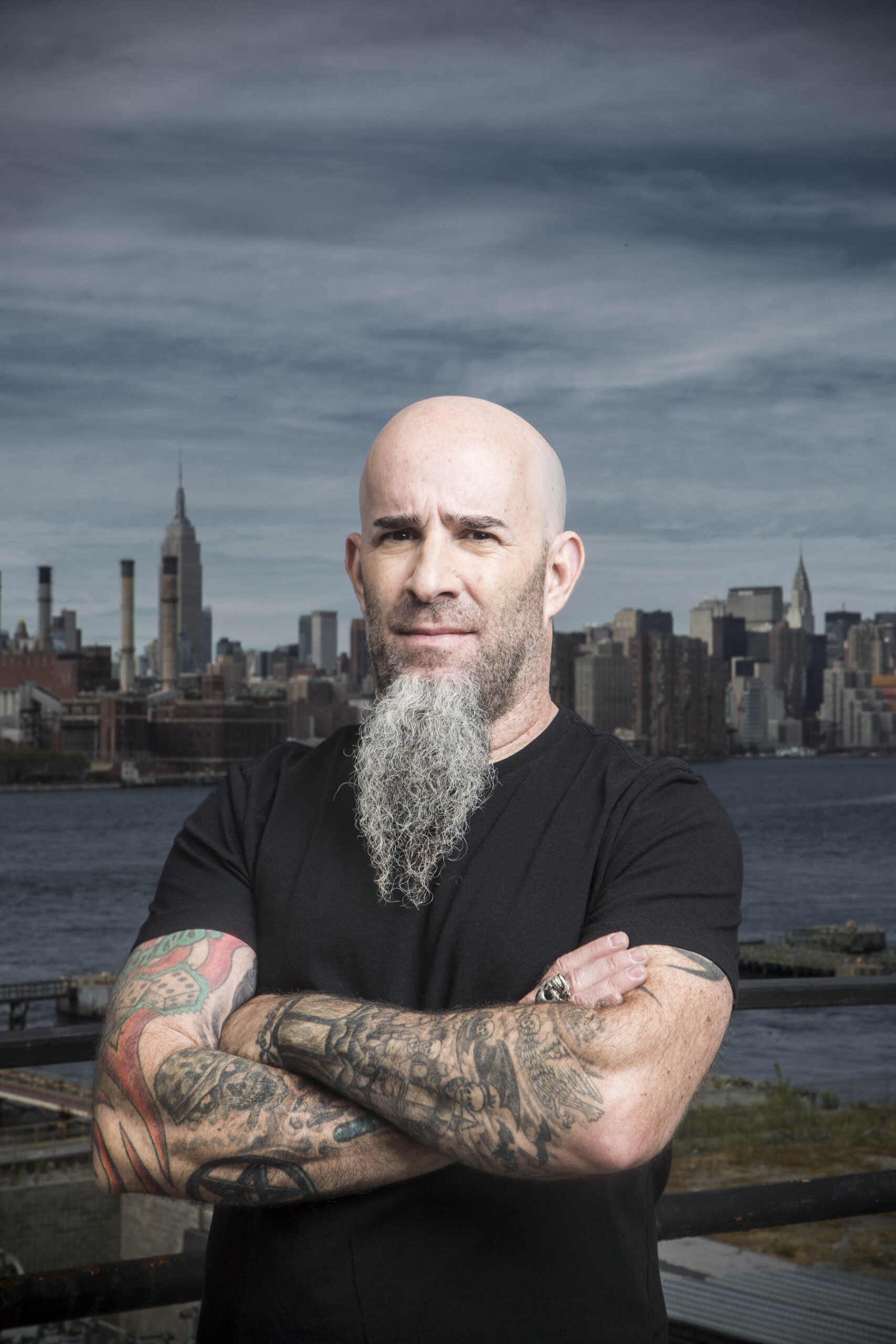 Scott Ian tattooed arms city portrait
