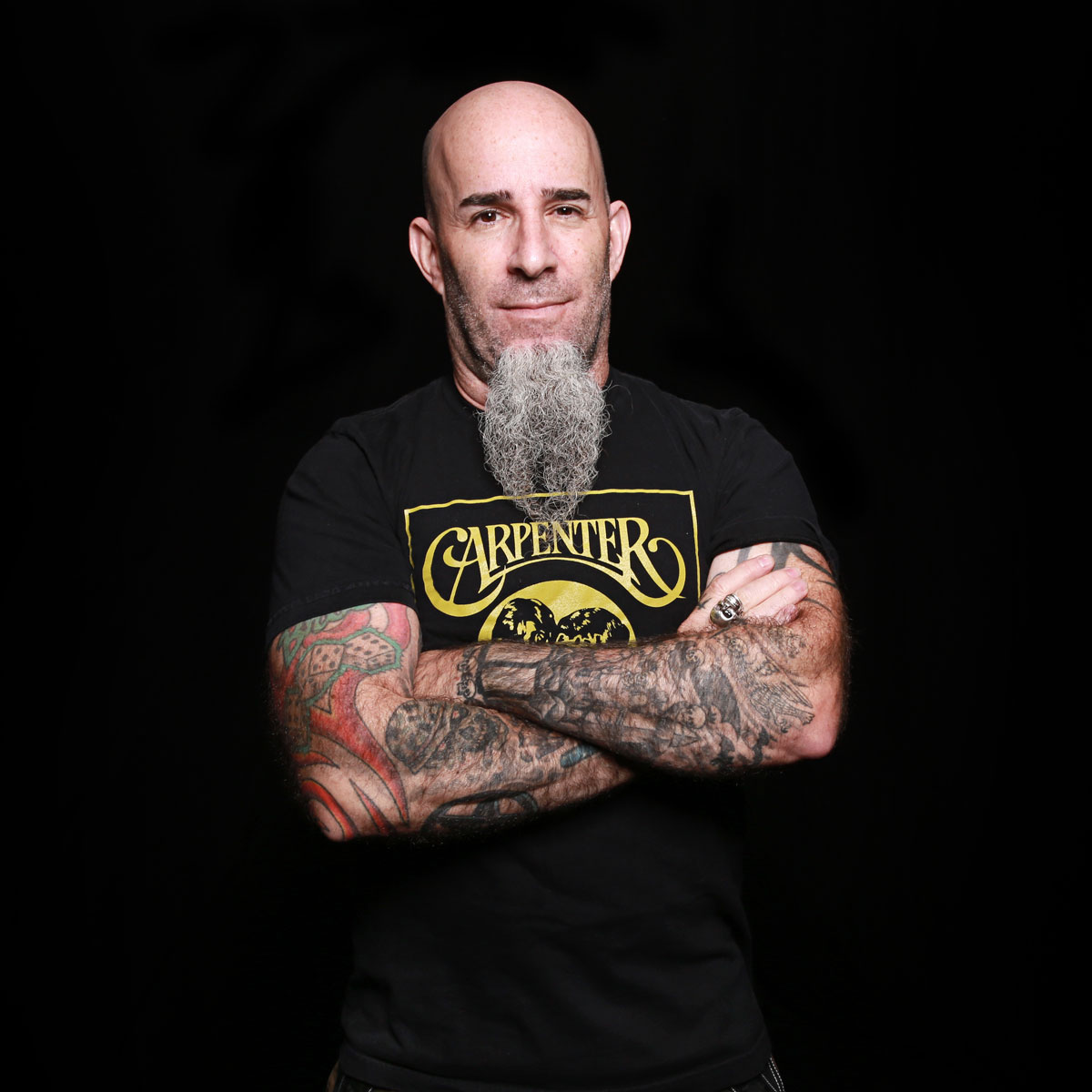 Scott Ian tattooed arms crossed portrait