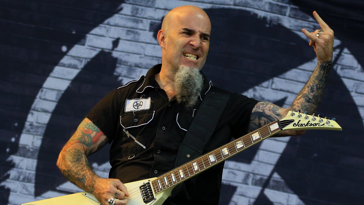 Scott Ian tattooed arms playing guitar