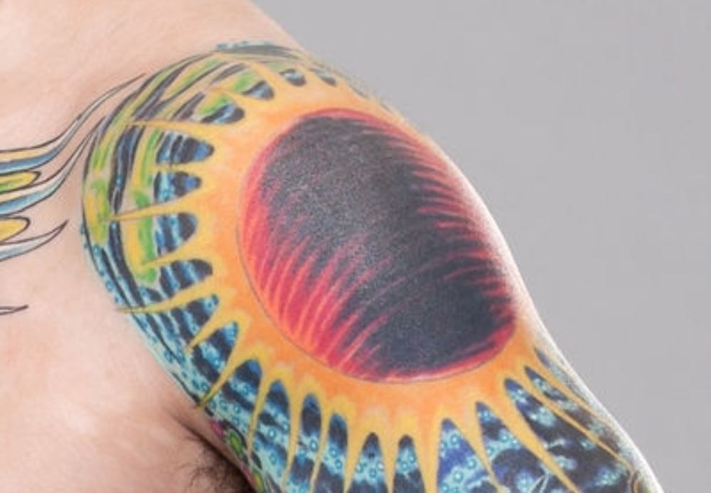 Scott Jorgensen tattoos: The sun design on his left shoulder