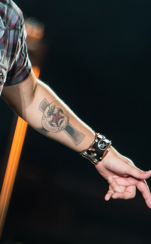 Scott Stapp cross forearm tattoo close-up