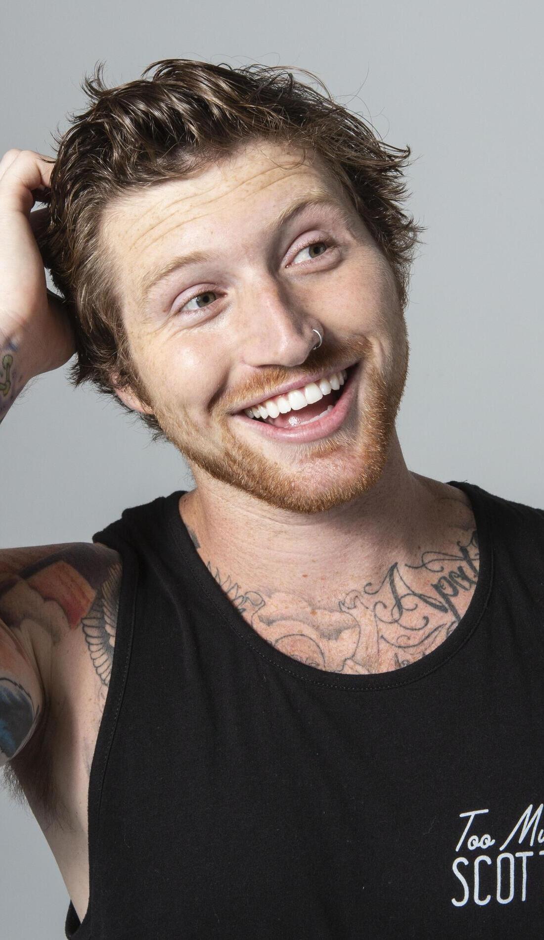 Scotty Sire tattoos: Tattoo evidence: high-resolution promotional close portrait showing the chest and shoulder ink in a separate pose.