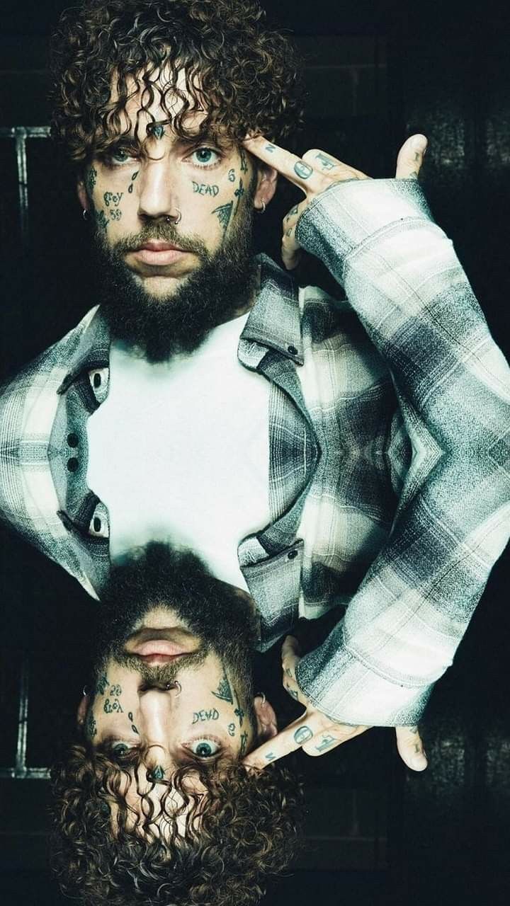 Scrim tattoos: face lettering and tattooed hands in a mirrored portrait