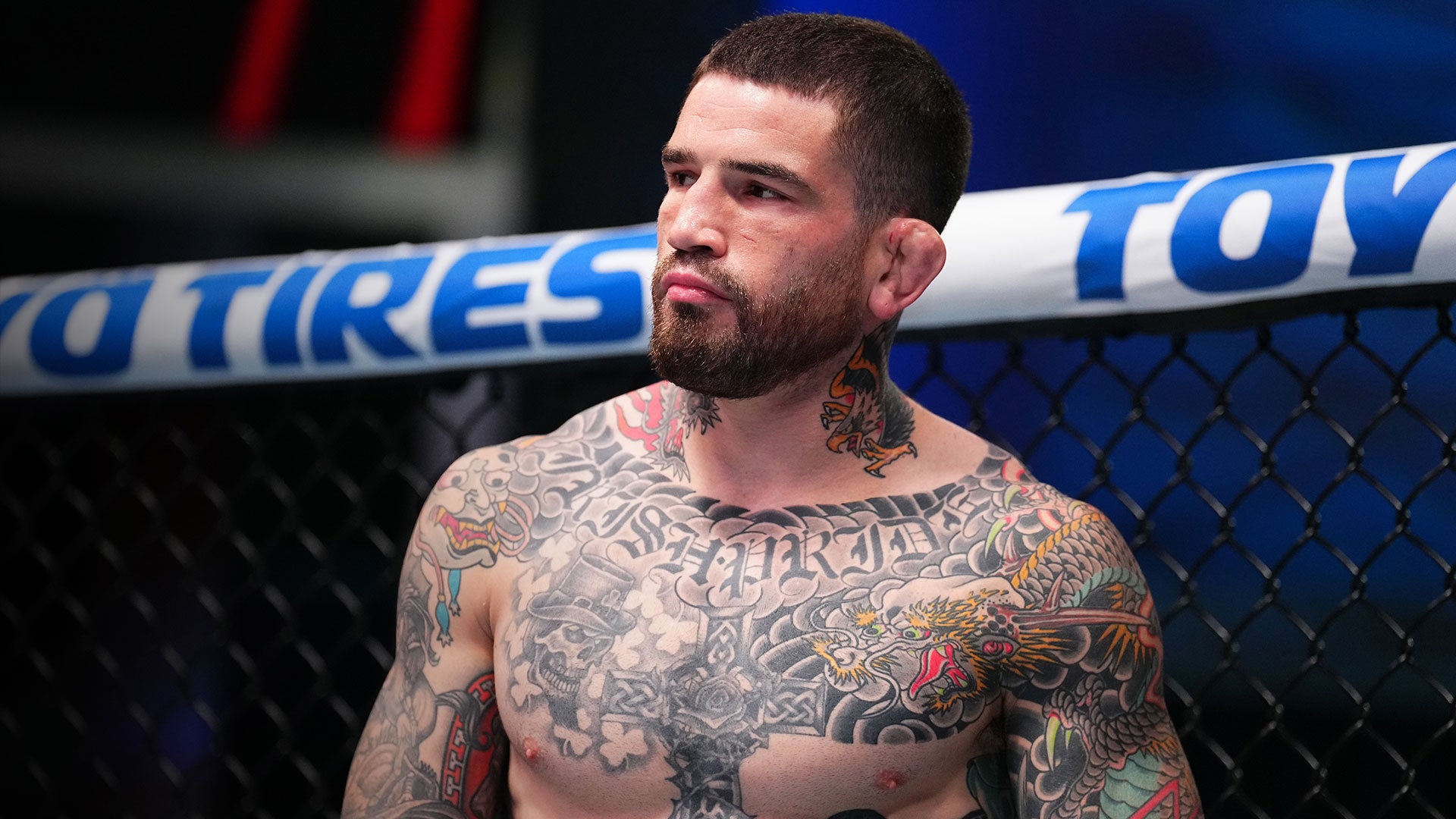 Sean Brady tattoos: chest lettering and neck tattoos