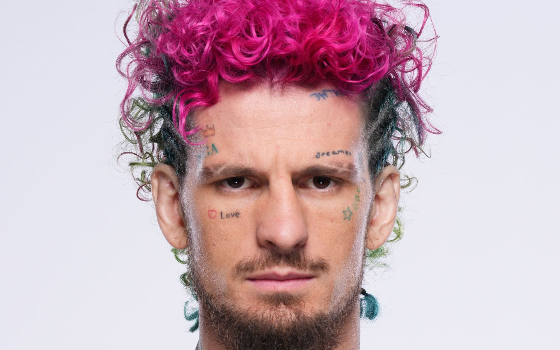 Sean O'Malley showing his face and neck tattoos