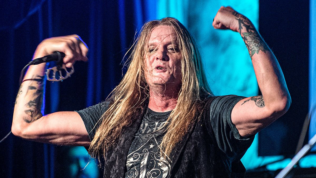 Sebastian Bach flexed arm tattoos