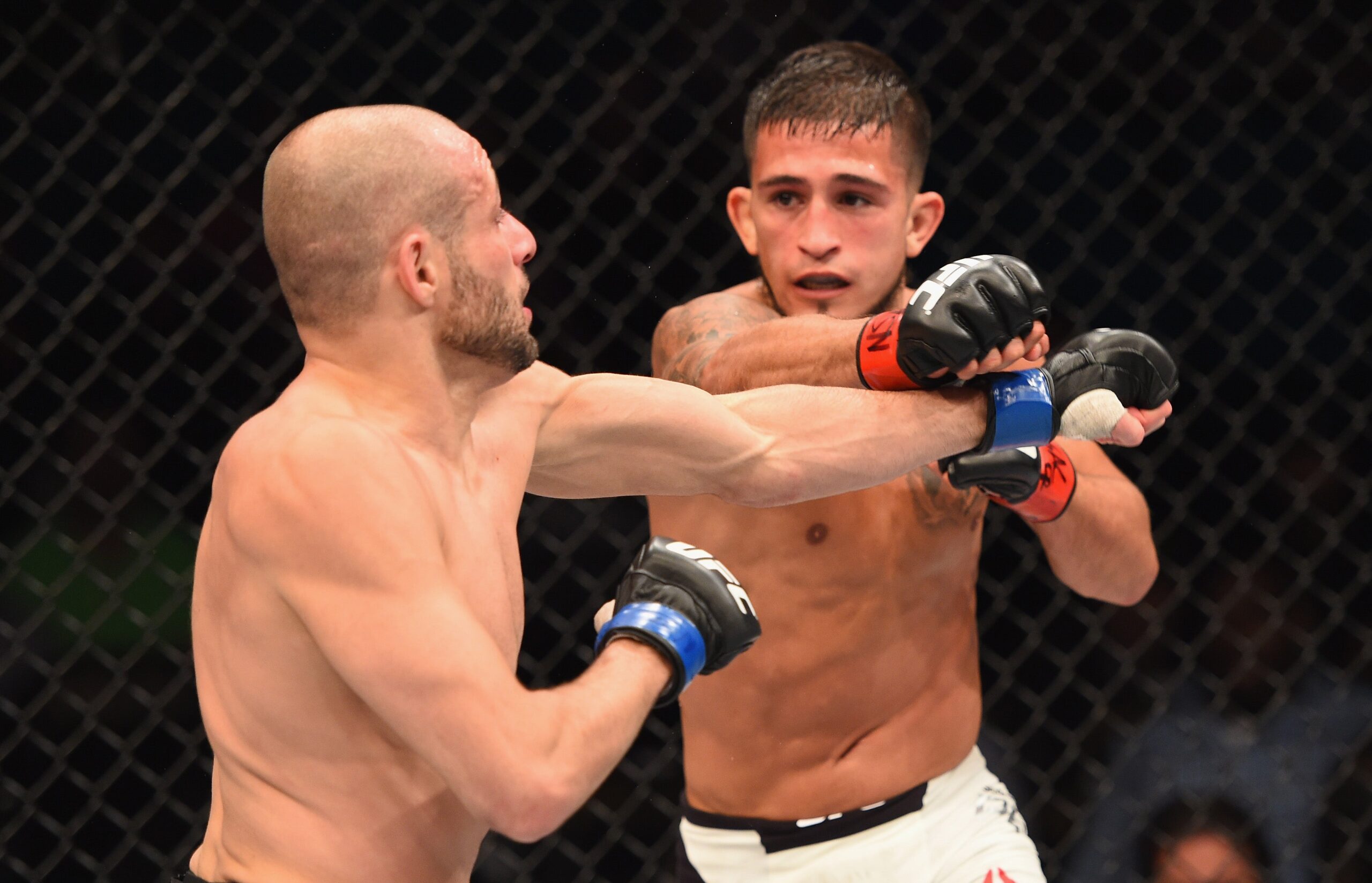 Sergio Pettis A guarded exchange in the Octagon Sergio Pettis in a contextual photograph: A guarded exchange in the Octagon; not tattoo evidence