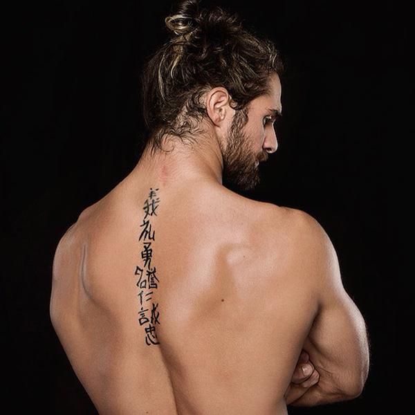 Seth Rollins Japanese character Bushido back tattoo from an angled view