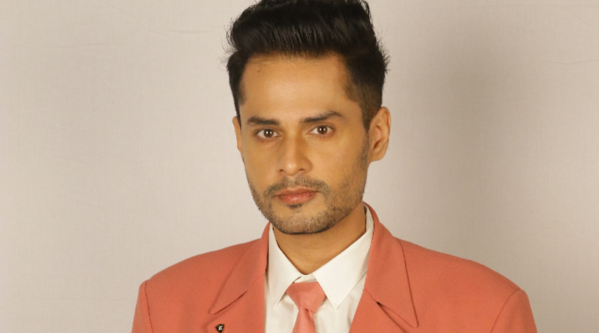 Shardul Pandit in a coral suit Shardul Pandit in a contextual photograph: inline; not tattoo evidence