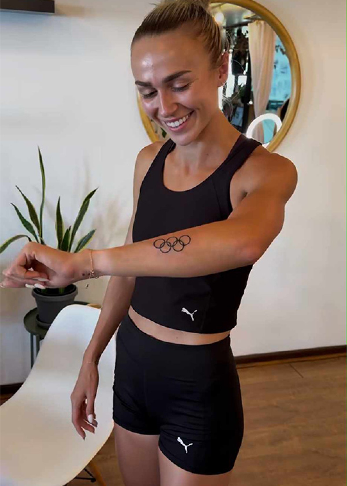 Sharlene Mawdsley tattoos: documented Olympic rings tattoo on the left forearm