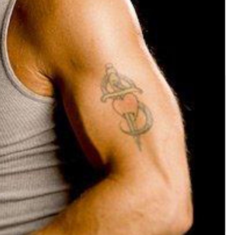 Shawn Michaels heart and dagger shoulder tattoo close-up