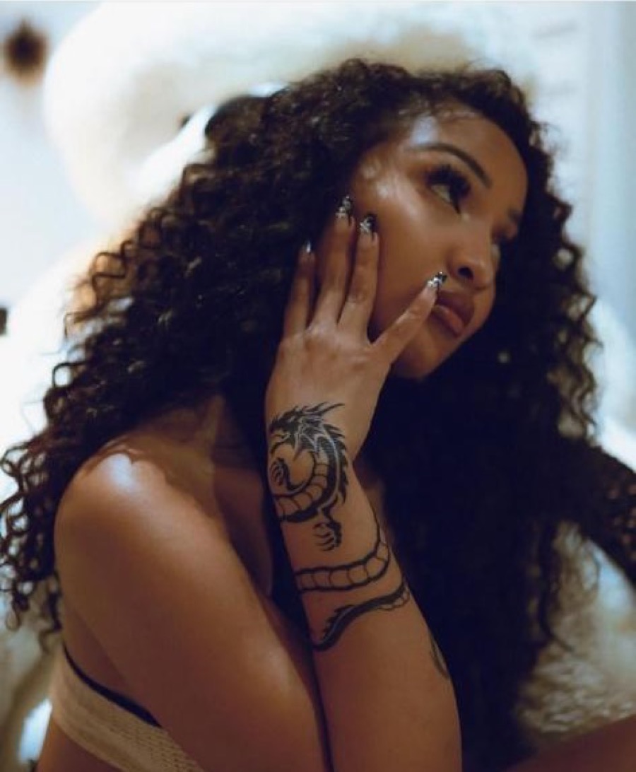 Shenseea dragon forearm close-up Shenseea tattoos: Shenseea's dragon tattoo from a second angle
