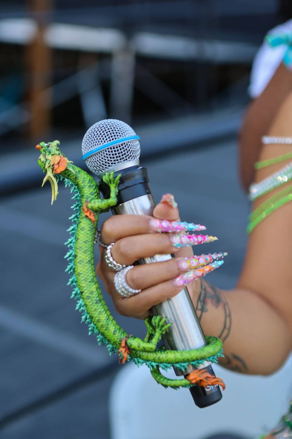 Shenseea Coachella arm tattoo Shenseea tattoos: Shenseea's visible arm tattoo and strength lettering