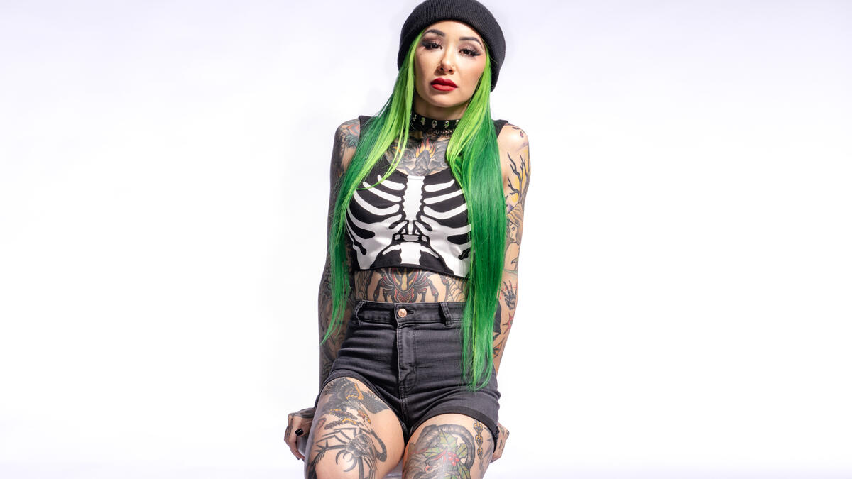 Shotzi front torso and leg tattoos