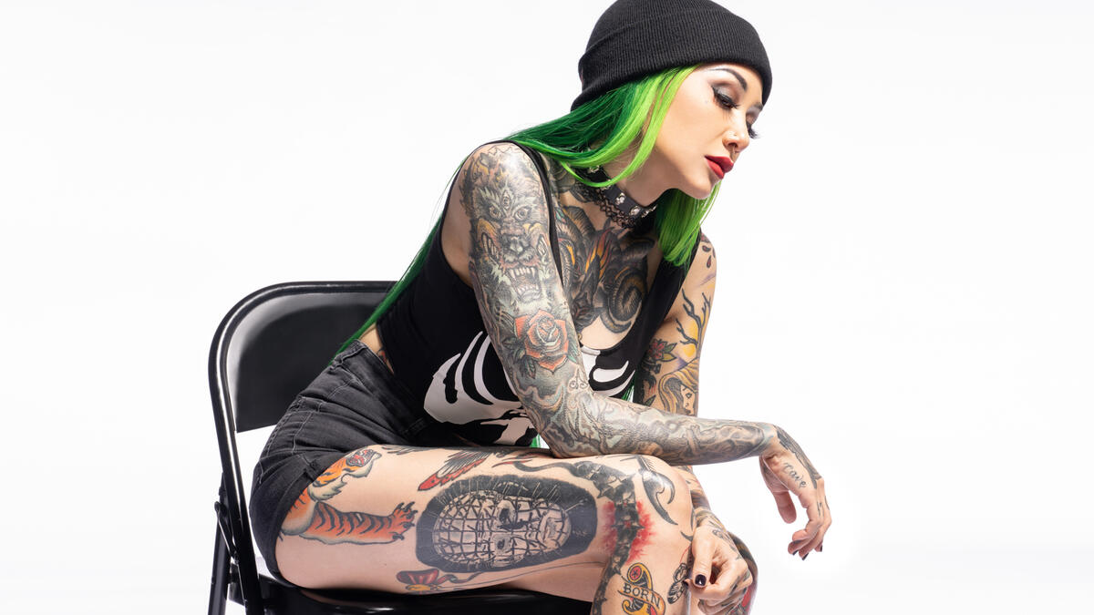 Shotzi shoulder and thigh tattoos