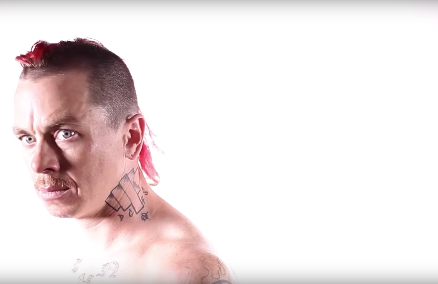 Sid Wilson tattoos: high-resolution portrait clearly showing the face marks and geometric neck tattoo