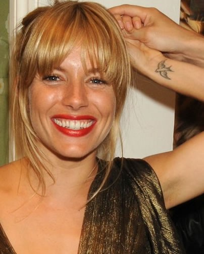 Sienna Miller wrist swallow tattoo Sienna Miller tattoos: Barry the Bird wrist swallow