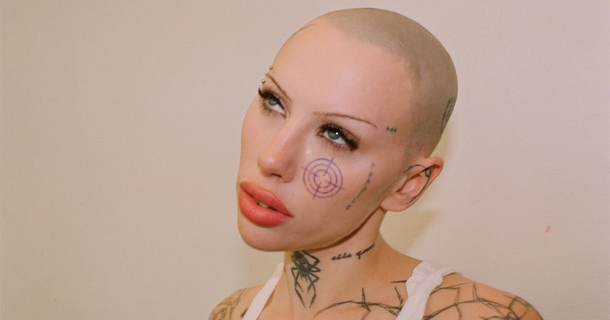 Siiickbrain tattoos: Siiickbrain face, cheek and neck tattoo