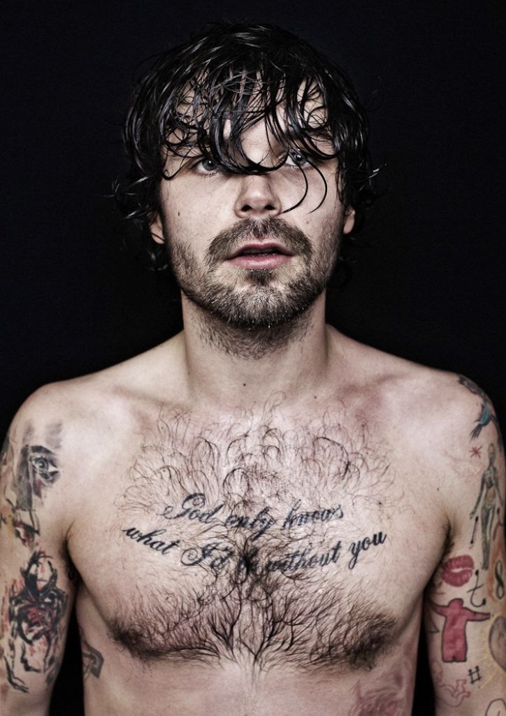 Simon Neil chest lyrics tattoo