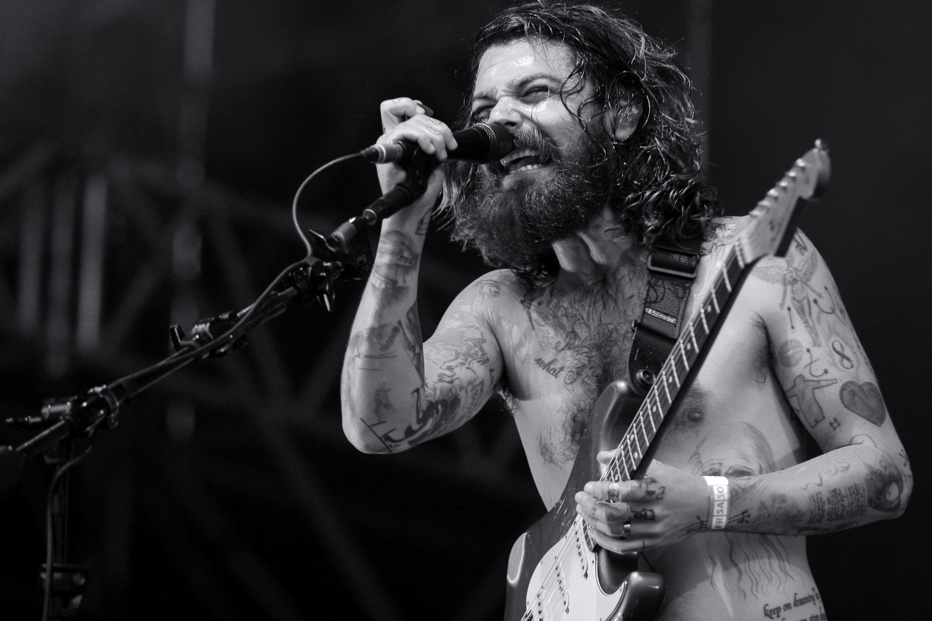 Simon Neil guitar arm tattoos