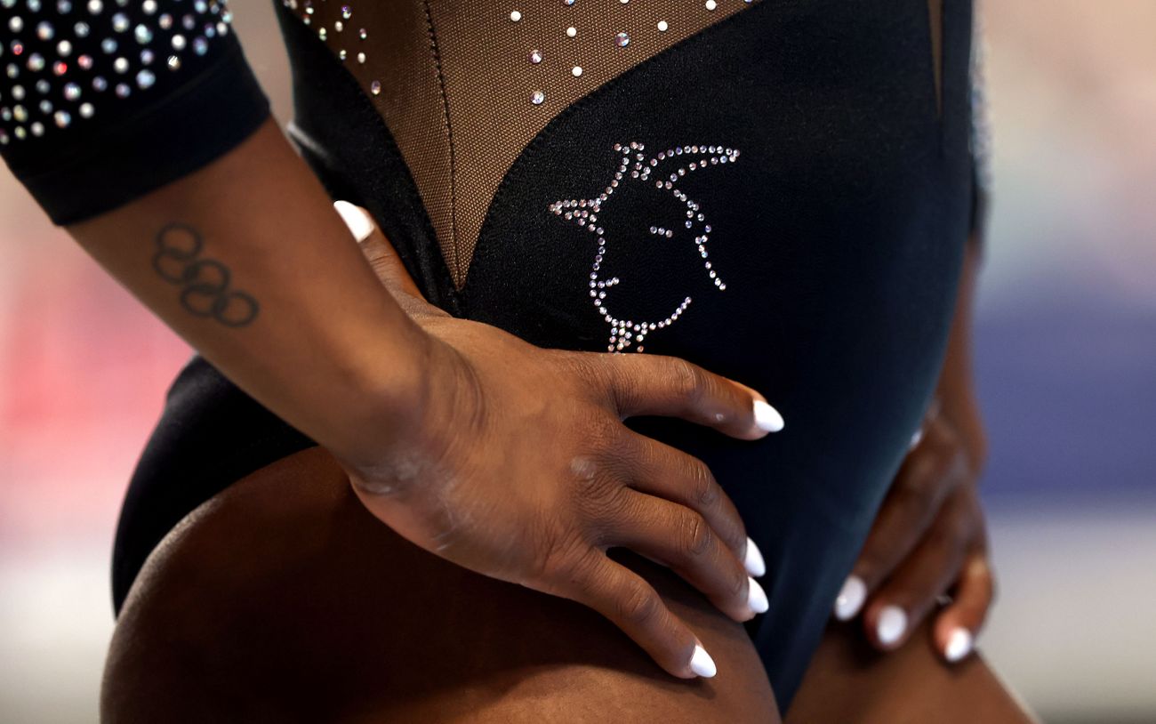 Simone Biles right forearm Olympic rings clearly visible during competition Simone Biles tattoos: right forearm Olympic rings clearly visible during competition