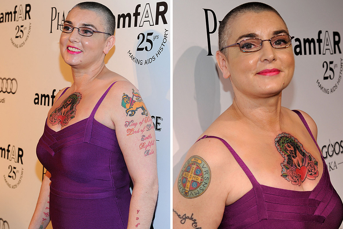 Sinéad O'Connor tattoos: Sinéad O'Connor chest and upper-arm tattoos, selected because the named tattoo area is clearly visible in a distinct high-resolution photograph