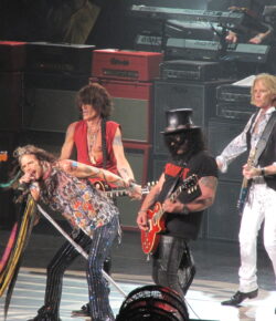 Slash Tattoos: Forearm Ink, Rocker Symbols and Guitar Stage Style