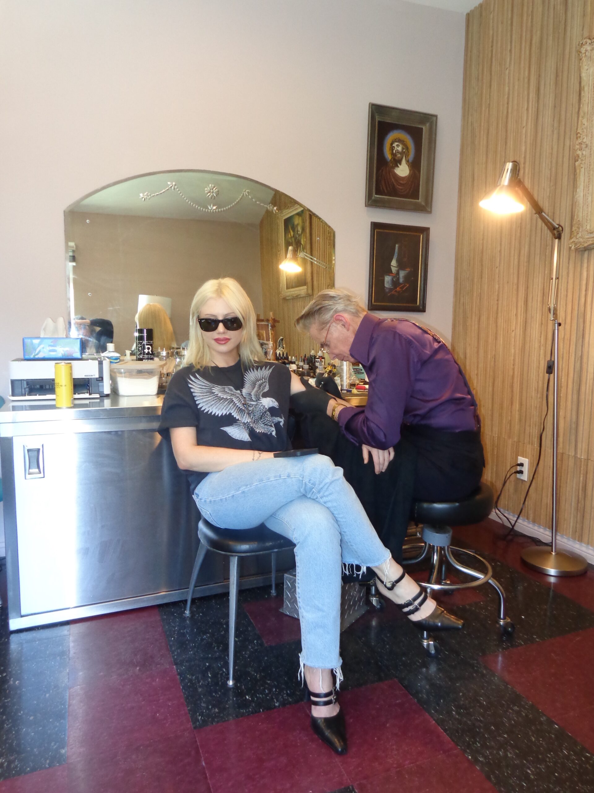 Slayyyter in a contextual photograph: Contextual studio photograph; explicitly not used as tattoo evidence.; not tattoo evidence