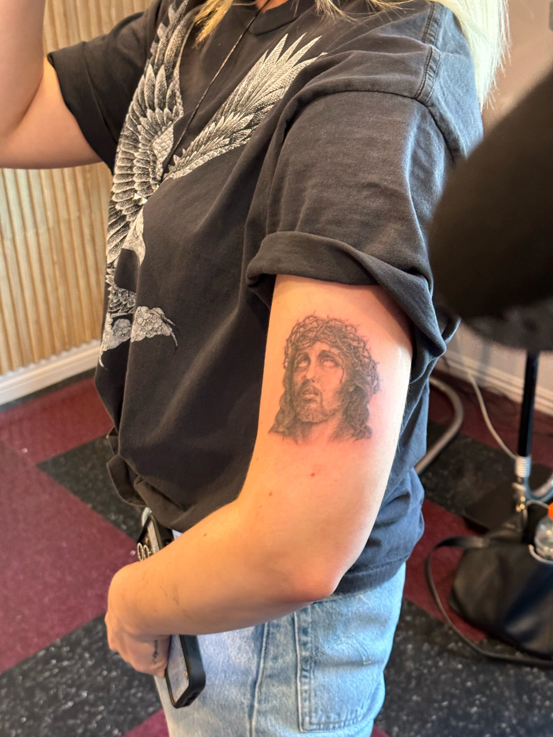Slayyyter tattoos: Genuine close-up tattoo evidence for the Jesus portrait section.