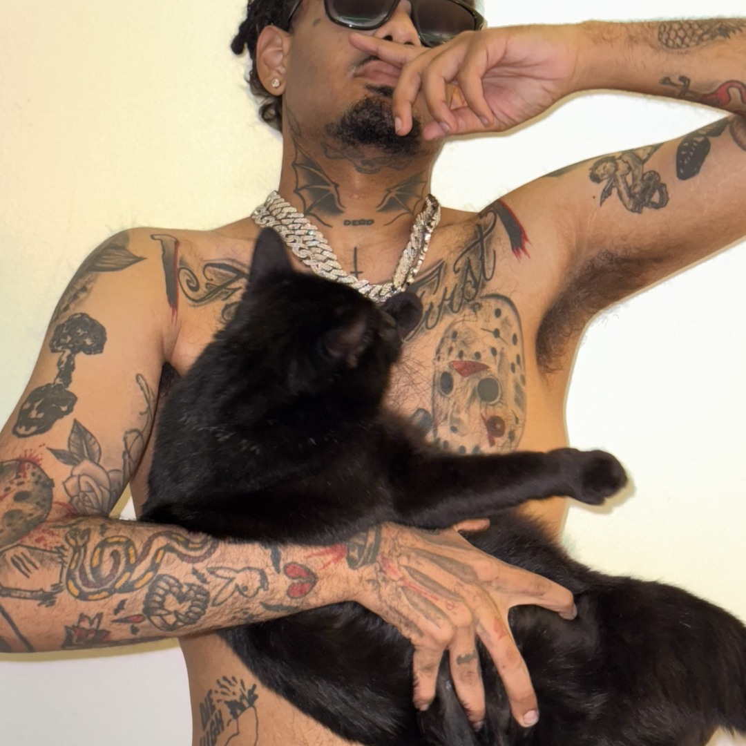 Smokepurpp tattoos: high-resolution shirtless portrait showing the chest, upper arms and forearm tattoos