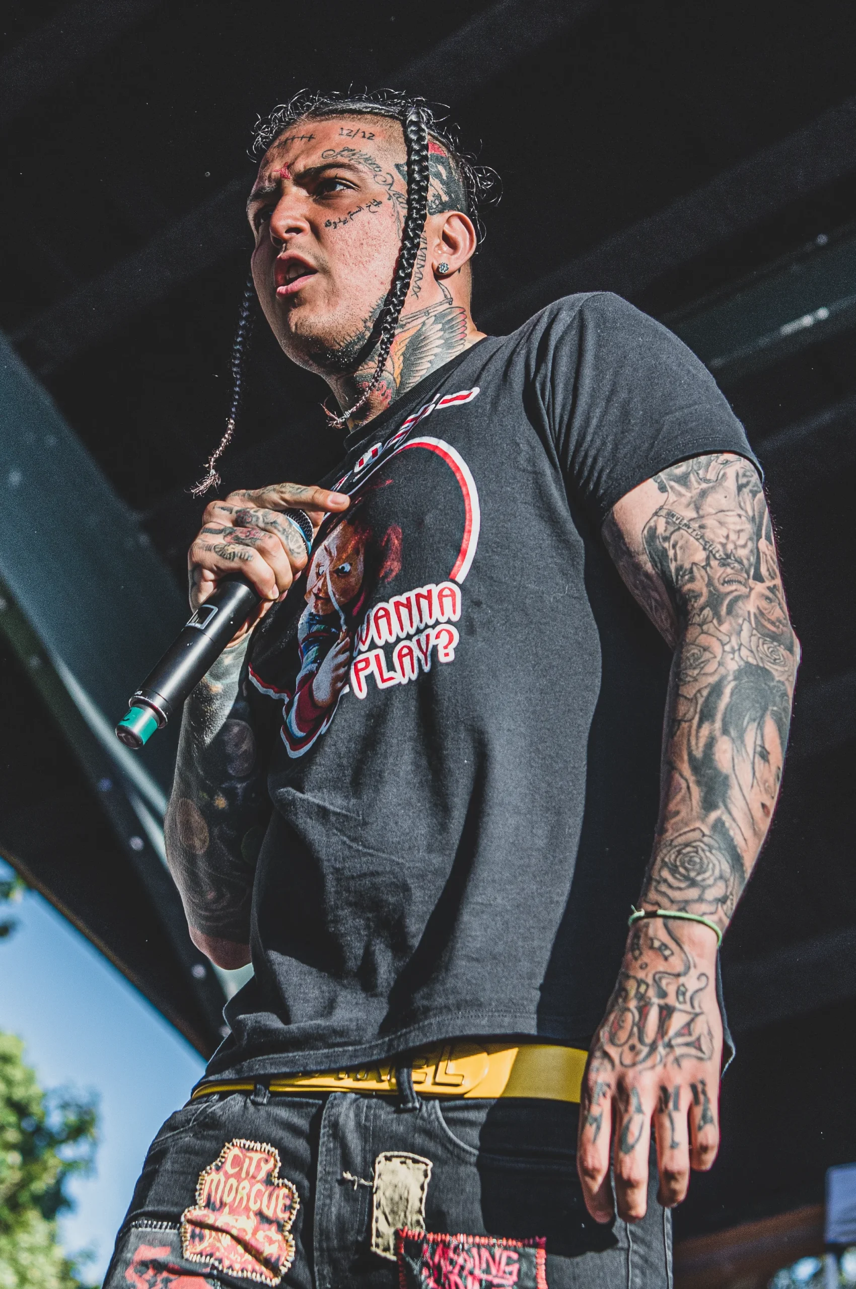 SosMula face neck and arm tattoos
